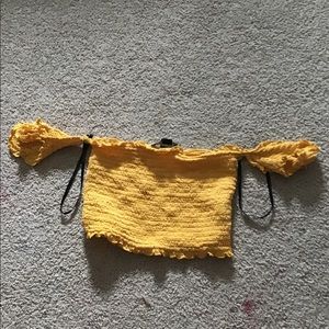 yellow off-the-shoulder shirt